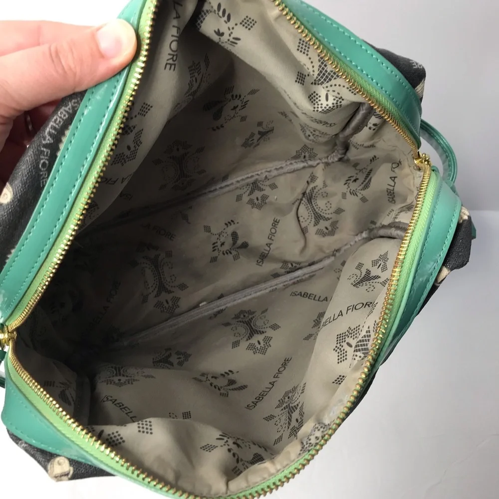 Isabella Fiore black and teal tassels make up bag